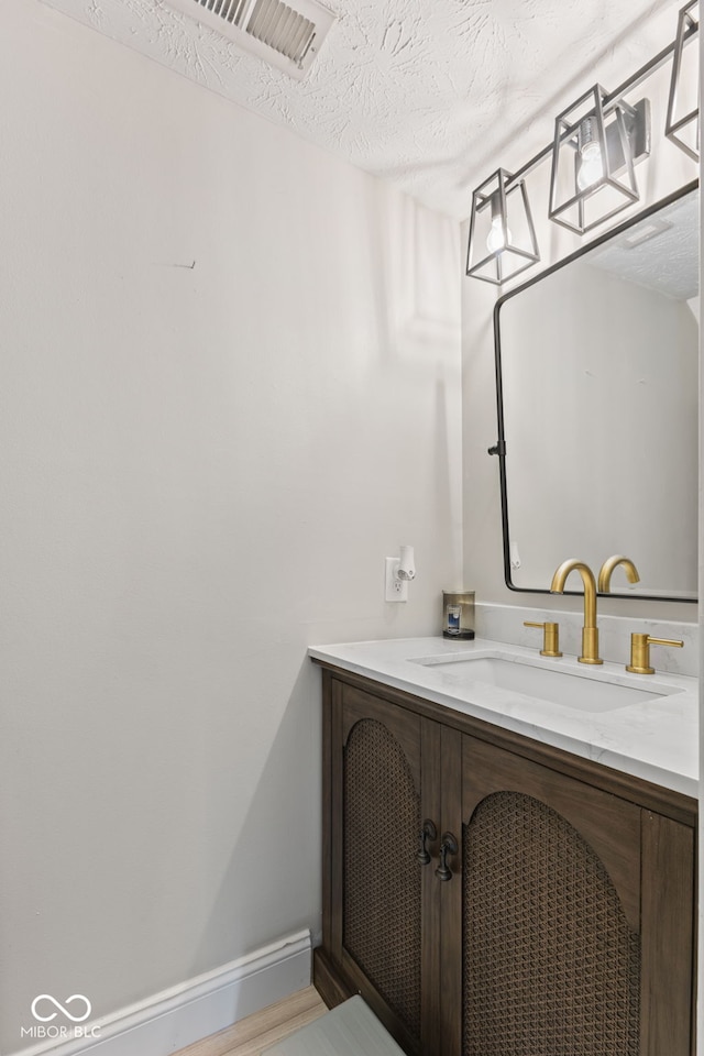 2580 Bluewood Way, Plainfield, IN 46168 - bathroom with vanity and a textured ceiling