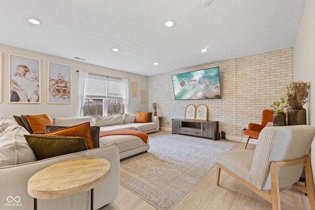 2580 Bluewood Way, Plainfield, IN 46168 - living room with brick wall, wood finished floors, and recessed lighting