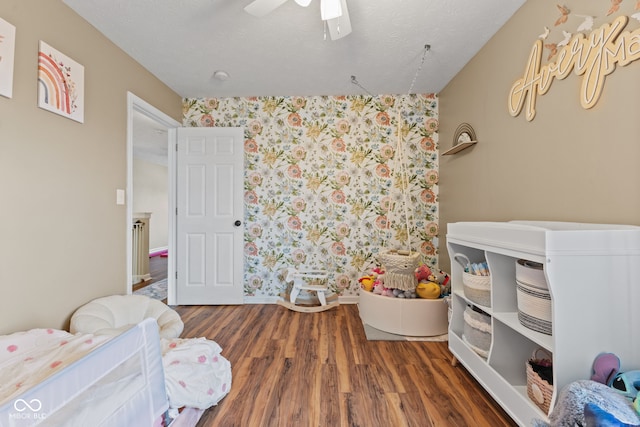 2580 Bluewood Way, Plainfield, IN 46168 - bedroom with wood finished floors, wallpapered walls, and ceiling fan
