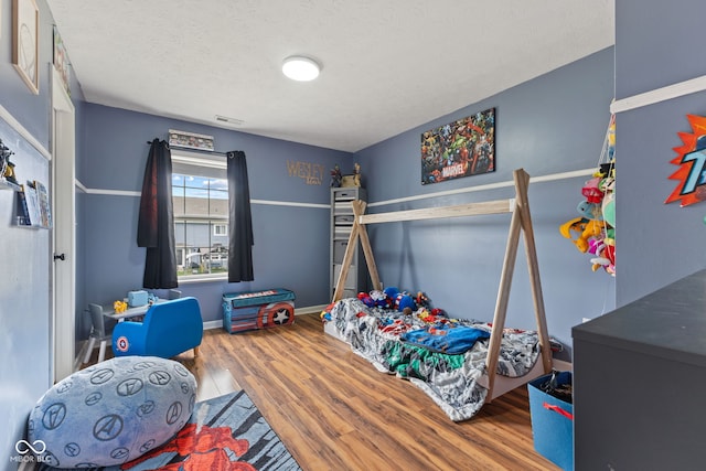 2580 Bluewood Way, Plainfield, IN 46168 - bedroom with wood finished floors and baseboards