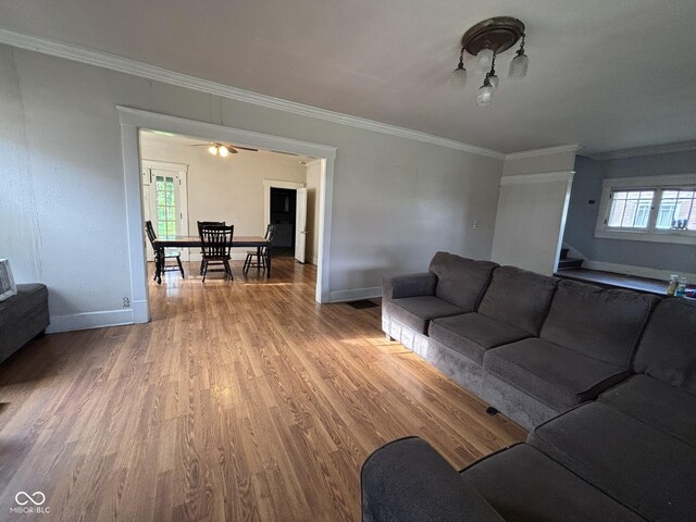 18 E Church St, Brazil, IN 47834 - living room with crown molding, light wood-style flooring, and baseboards