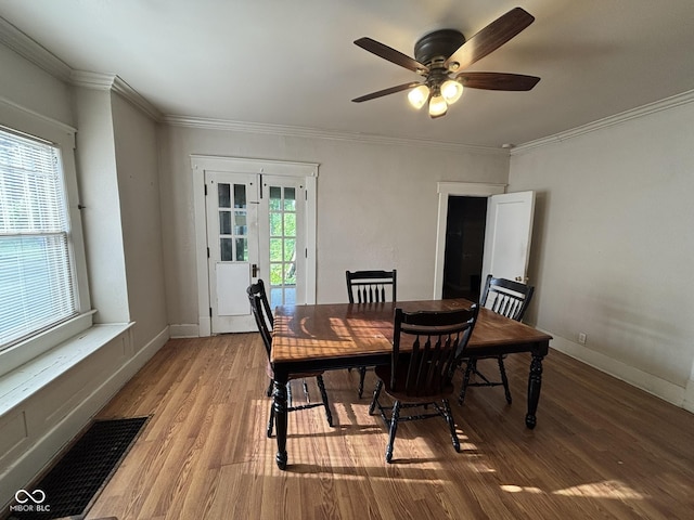 18 E Church St, Brazil, IN 47834 - dining area featuring wood finished floors, a ceiling fan, ornamental molding, and baseboards
