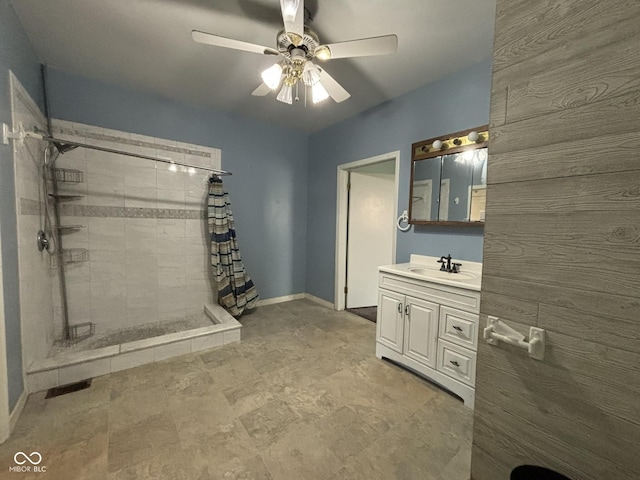 18 E Church St, Brazil, IN 47834 - bathroom featuring tiled shower, a ceiling fan, vanity, and baseboards