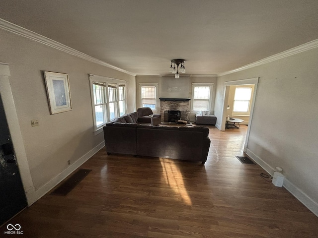 18 E Church St, Brazil, IN 47834 - living area with ornamental molding, a fireplace, wood finished floors, and baseboards