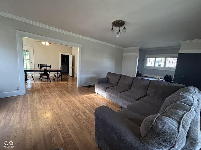 18 E Church St, Brazil, IN 47834 - living area with wood finished floors, crown molding, and baseboards