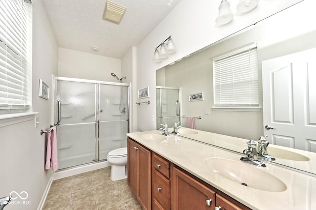 15937 Marsala Dr, Fishers, IN 46037 - full bath featuring a shower stall, double vanity, toilet, and baseboards