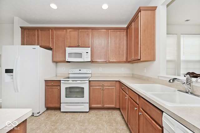 15937 Marsala Dr, Fishers, IN 46037 - kitchen featuring white appliances, a sink, light countertops, brown cabinets, and recessed lighting