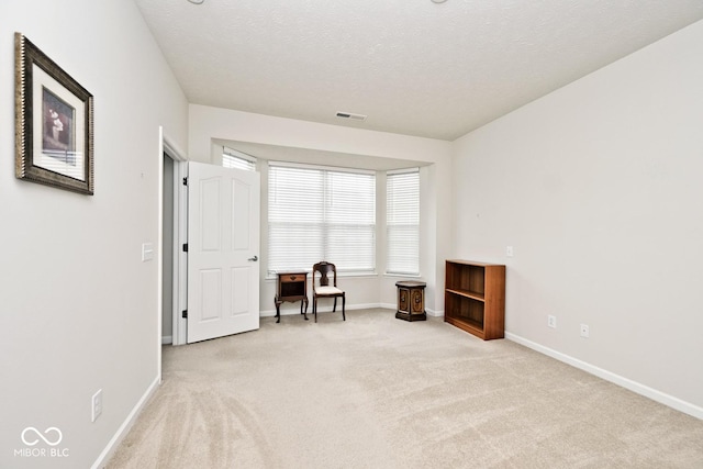15937 Marsala Dr, Fishers, IN 46037 - sitting room featuring carpet, baseboards, an office area, and a textured ceiling