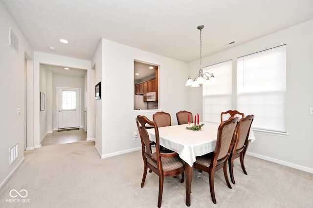 15937 Marsala Dr, Fishers, IN 46037 - dining space featuring a chandelier, baseboards, light carpet, and recessed lighting