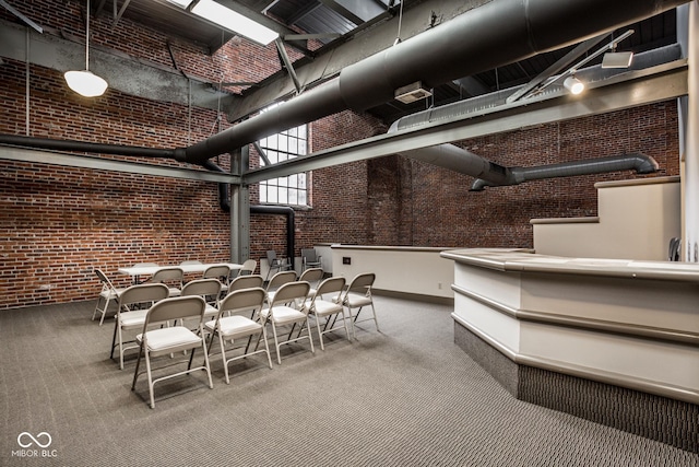 611 N Park Ave Unit 104, Indianapolis, IN 46204 - basement with brick wall and carpet floors
