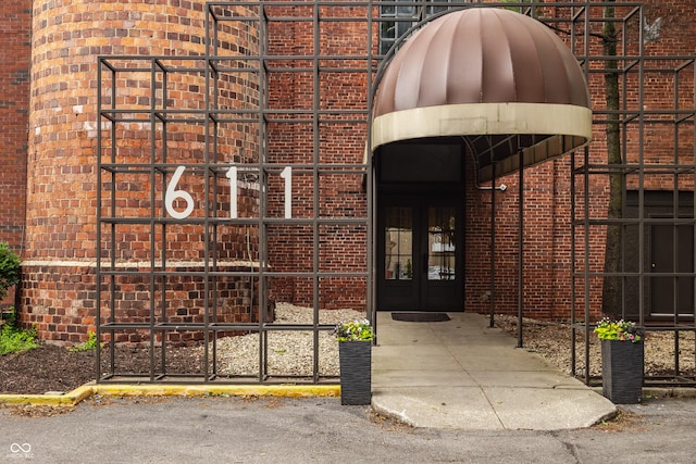 611 N Park Ave Unit 104, Indianapolis, IN 46204 - view of exterior entry with french doors and brick siding