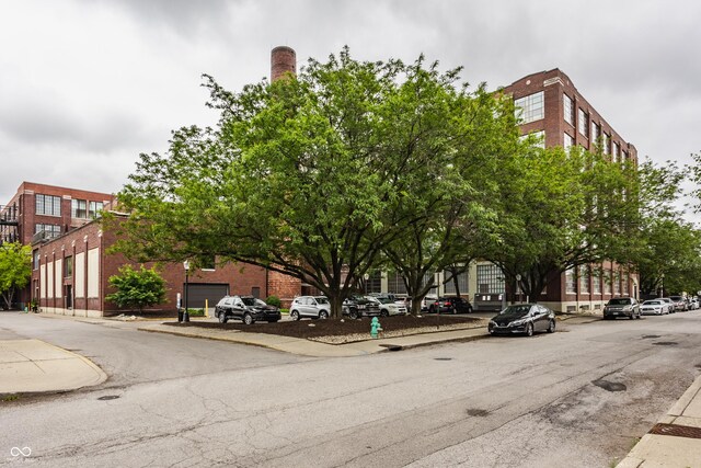611 N Park Ave Unit 104, Indianapolis, IN 46204 - view of asphalt road featuring sidewalks and curbs