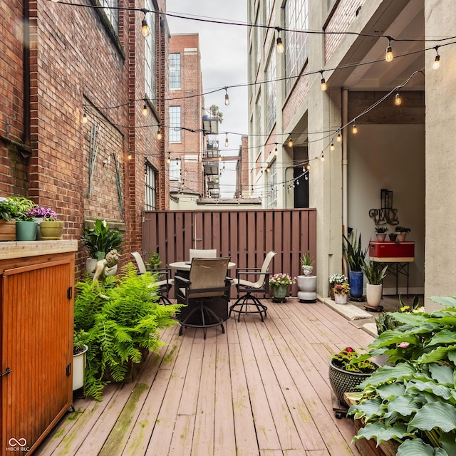 611 N Park Ave Unit 104, Indianapolis, IN 46204 - wooden terrace with outdoor dining area