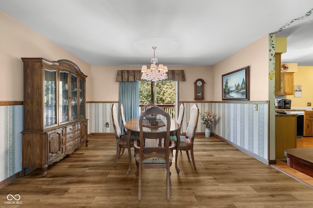 1350 Inverness Farms Rd, Martinsville, IN 46151 - dining area featuring a chandelier, wood finished floors, and wallpapered walls