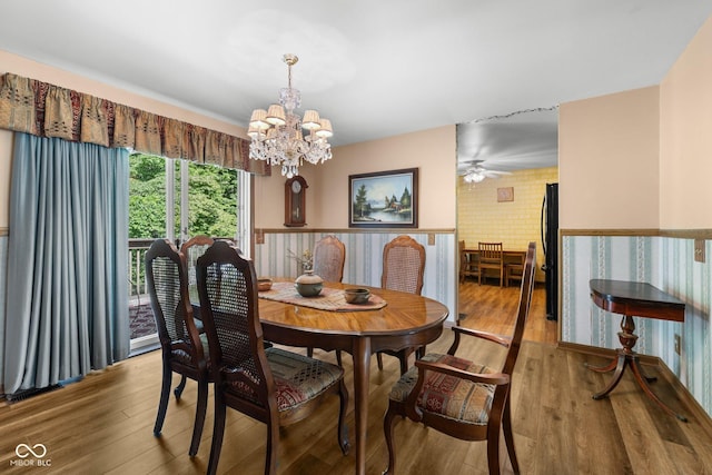 1350 Inverness Farms Rd, Martinsville, IN 46151 - dining space featuring wood finished floors, wainscoting, a chandelier, and ceiling fan