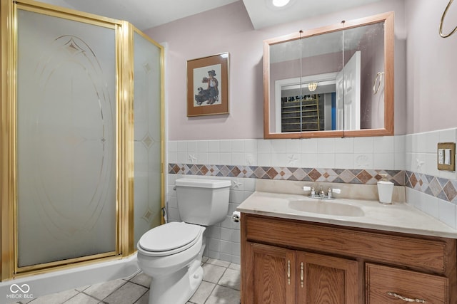 1350 Inverness Farms Rd, Martinsville, IN 46151 - bathroom with vanity, tile patterned floors, a stall shower, wainscoting, and tile walls