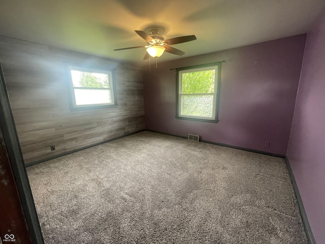 4363 Roosevelt Dr, Columbus, IN 47201 - empty room featuring healthy amount of natural light, carpet flooring, a ceiling fan, and baseboards