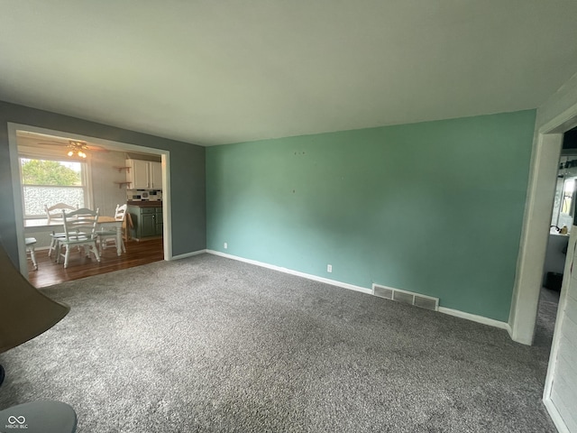 4363 Roosevelt Dr, Columbus, IN 47201 - unfurnished living room featuring carpet flooring and baseboards