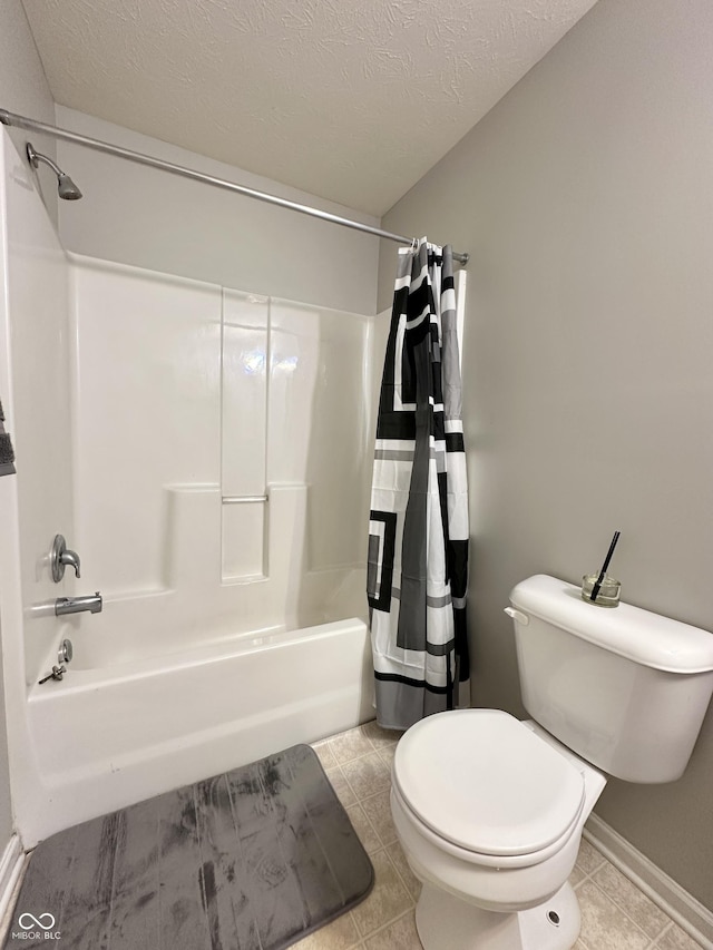 4925 Chip Shot Ln, Indianapolis, IN 46235 - bathroom with shower / tub combo, tile patterned floors, toilet, a textured ceiling, and baseboards