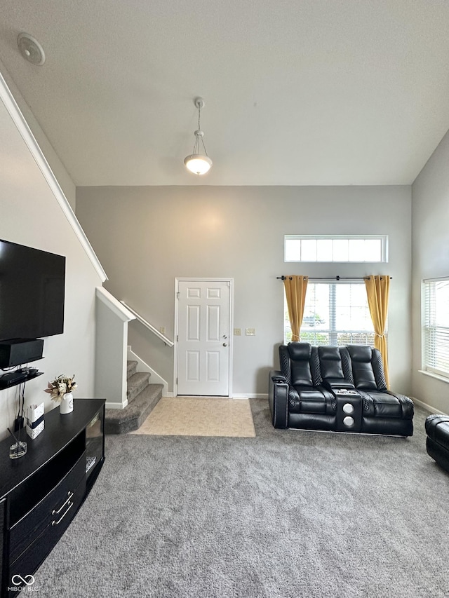 4925 Chip Shot Ln, Indianapolis, IN 46235 - living area featuring stairway, carpet flooring, and baseboards