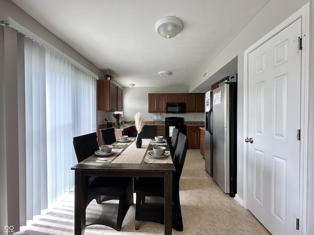 4925 Chip Shot Ln, Indianapolis, IN 46235 - dining room featuring a textured ceiling