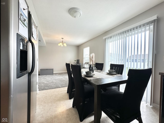 4925 Chip Shot Ln, Indianapolis, IN 46235 - dining room featuring a chandelier, light colored carpet, and baseboards