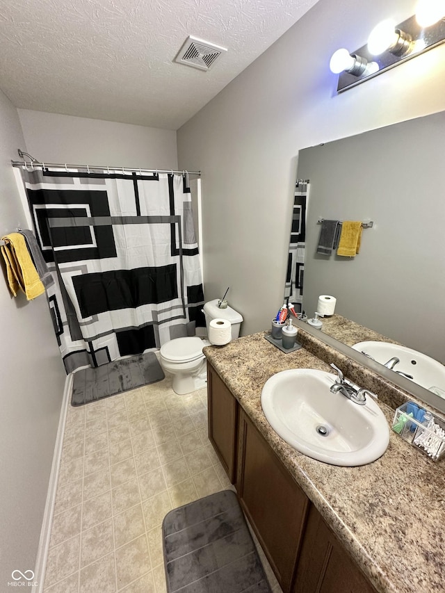 4925 Chip Shot Ln, Indianapolis, IN 46235 - full bath with vanity, toilet, a shower with curtain, a textured ceiling, and tile patterned flooring