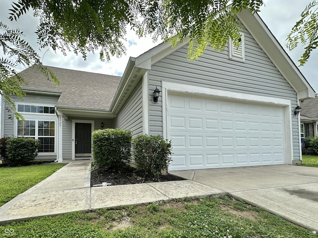4925 Chip Shot Ln, Indianapolis, IN 46235 - single story home with driveway, an attached garage, and a shingled roof