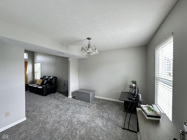 4925 Chip Shot Ln, Indianapolis, IN 46235 - sitting room with a chandelier, carpet floors, a textured ceiling, and baseboards