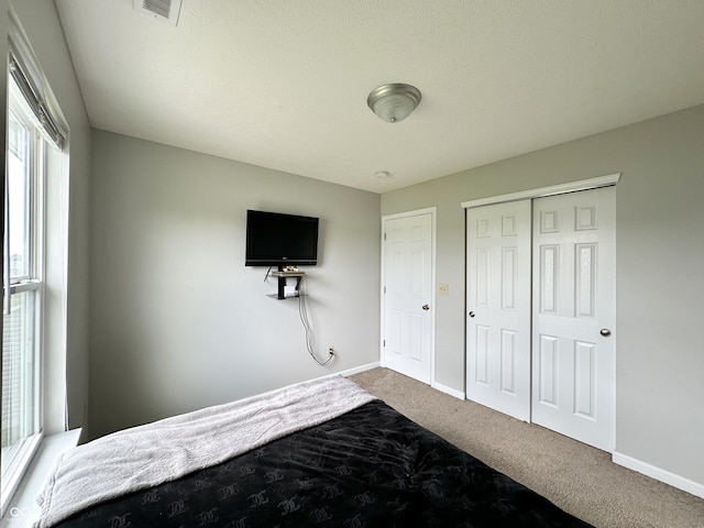4925 Chip Shot Ln, Indianapolis, IN 46235 - bedroom featuring carpet, baseboards, and a closet