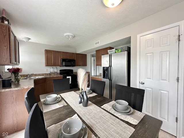 4925 Chip Shot Ln, Indianapolis, IN 46235 - dining space with a textured ceiling