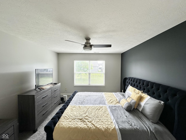 4925 Chip Shot Ln, Indianapolis, IN 46235 - bedroom featuring a textured ceiling, a ceiling fan, and dark carpet