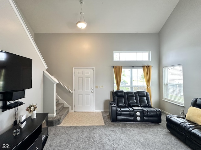 4925 Chip Shot Ln, Indianapolis, IN 46235 - living area featuring a towering ceiling, stairs, carpet flooring, and baseboards