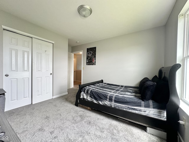 4925 Chip Shot Ln, Indianapolis, IN 46235 - bedroom featuring carpet flooring, a closet, and baseboards