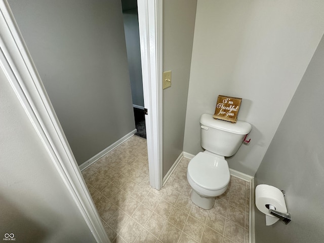 4925 Chip Shot Ln, Indianapolis, IN 46235 - bathroom featuring toilet, baseboards, and tile patterned flooring