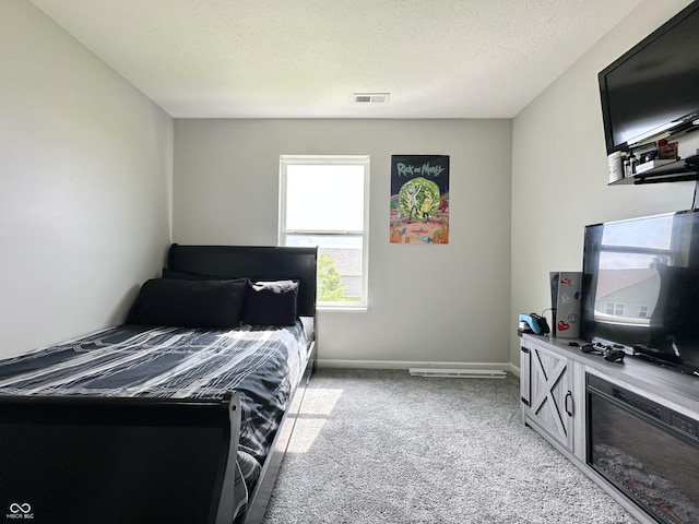 4925 Chip Shot Ln, Indianapolis, IN 46235 - bedroom with light carpet, a textured ceiling, and baseboards