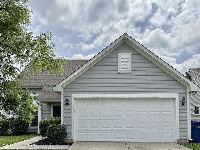 4925 Chip Shot Ln, Indianapolis, IN 46235 - view of front of property featuring a shingled roof, concrete driveway, and an attached garage