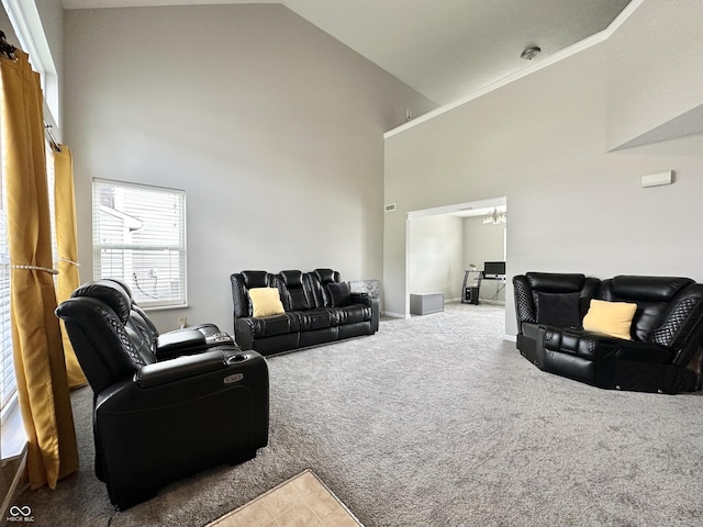 4925 Chip Shot Ln, Indianapolis, IN 46235 - carpeted living area with high vaulted ceiling, baseboards, and a chandelier