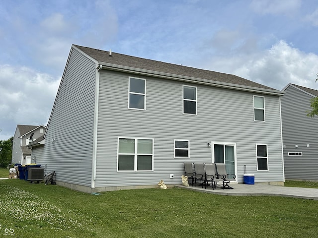 4925 Chip Shot Ln, Indianapolis, IN 46235 - rear view of house with central air condition unit, a patio area, and a yard
