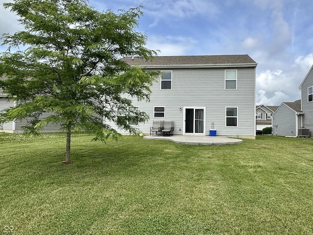 4925 Chip Shot Ln, Indianapolis, IN 46235 - back of house featuring a patio, a yard, and central AC unit