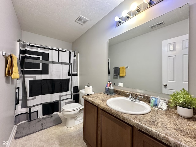 4925 Chip Shot Ln, Indianapolis, IN 46235 - bathroom featuring vanity, toilet, curtained shower, a textured ceiling, and tile patterned flooring