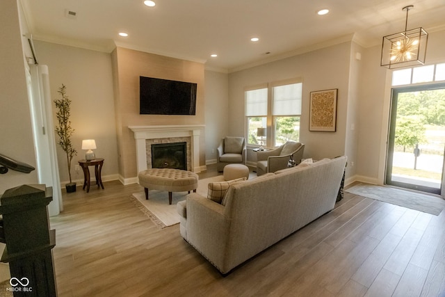 139 Wayfinder Dr, West Lafayette, IN 47906 - living room featuring plenty of natural light, crown molding, recessed lighting, baseboards, and a tiled fireplace