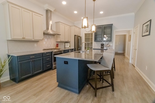 139 Wayfinder Dr, West Lafayette, IN 47906 - kitchen featuring appliances with stainless steel finishes, wall chimney range hood, backsplash, a sink, and glass insert cabinets