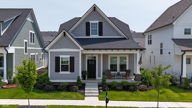 139 Wayfinder Dr, West Lafayette, IN 47906 - view of front facade with a porch, a front yard, and roof with shingles