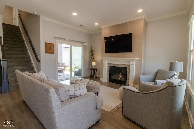 139 Wayfinder Dr, West Lafayette, IN 47906 - living area featuring wood finished floors, a lit fireplace, stairway, recessed lighting, and ornamental molding