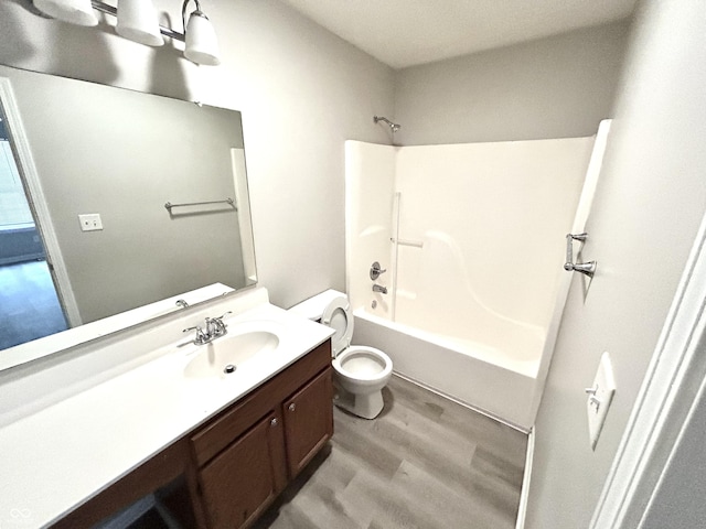 10922 Snowdrop Way, Indianapolis, IN 46235 - bathroom featuring toilet, vanity, wood finished floors, and bathtub / shower combination