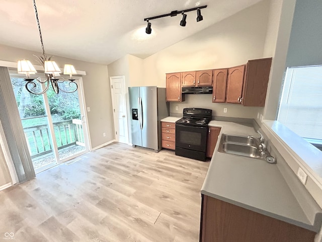 10922 Snowdrop Way, Indianapolis, IN 46235 - kitchen featuring electric range, stainless steel fridge, a sink, vaulted ceiling, and under cabinet range hood