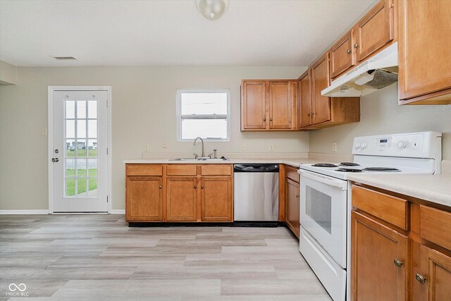 2834 Wolfgang Dr, Indianapolis, IN 46239 - kitchen featuring dishwasher, white range with electric stovetop, a sink, under cabinet range hood, and light countertops
