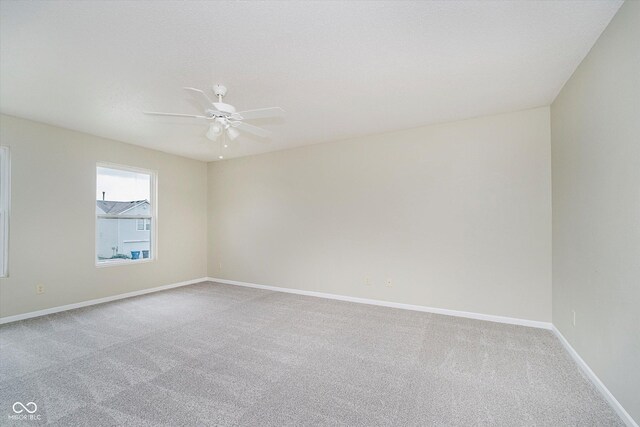 2834 Wolfgang Dr, Indianapolis, IN 46239 - carpeted empty room with baseboards and a ceiling fan