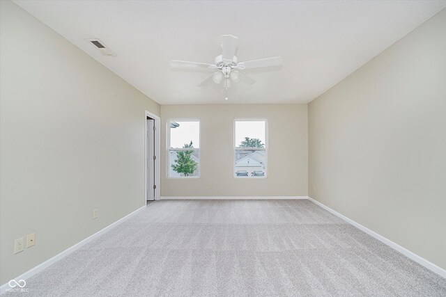 2834 Wolfgang Dr, Indianapolis, IN 46239 - empty room featuring a ceiling fan, light colored carpet, and baseboards